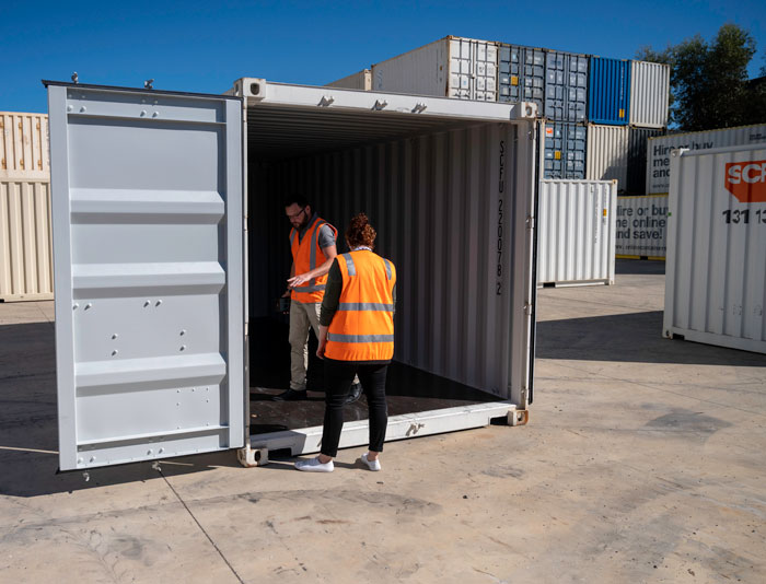 Inspecting an SCF container before buying one.