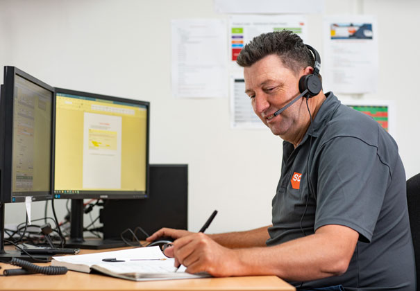 An SCF Customer Service representative on the phone